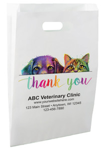 White die-cut handle paper bag featuring colorful dog and cat portraits above a rainbow thank you message.

