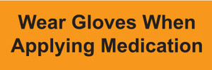 Orange label with Wear Gloves When Applying Medication printed in black text

