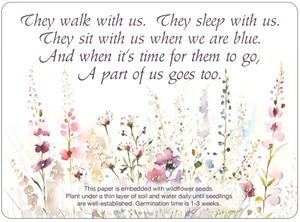 Wildflower seed memorial insert with memorial quote in dark script lettering above a watercolor-style meadow of pink, purple, and cream wildflowers.