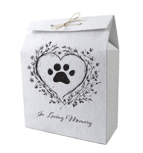 Plantable memorial bag featuring a black paw print inside a heart with floral accents and the phrase “In Loving Memory” beneath.