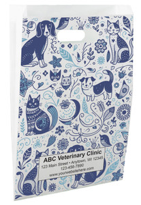 White die-cut handle paper bag featuring blue doodle-style dogs, cats, birds, flowers, leaves, hearts, and botanical illustrations in a full-coverage pattern.


