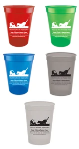 Personalized pet food measuring cup featuring a dog and cat playing silhouette above the phrase "Healthy pets are happy pets!" with customizable clinic name, address, phone number, fax number, and website information. Displayed in multiple cup colors with black or white imprint options.
