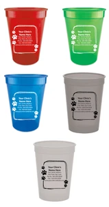 Personalized pet food measuring cup featuring a sketch-style rectangular border with paw print accents surrounding a custom clinic name, address, phone number, fax number, and website imprint area.