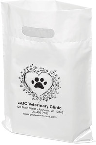 White veterinary tote bag featuring a black floral wreath forming a heart shape around a centered paw print. Beneath the design, visible text reads “ABC Veterinary Clinic” with a full address, phone number, and website, indicating space for your personalized clinic details.