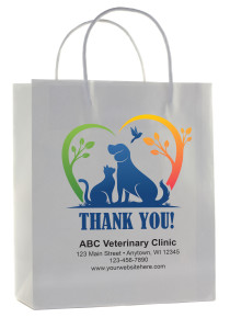 Veterinary handled paper bags in white and kraft showing dog and cat silhouettes inside heart with leaf accents, “THANK YOU!” text, and label panel.