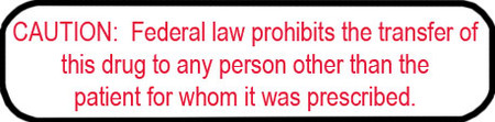 White rounded rectangle stickers with red text CAUTION Federal law prohibits the transfer of this drug to any person other than the patient for whom it was prescribed