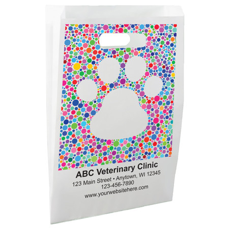 White die-cut handle paper bag featuring a large paw print silhouette formed from colorful circles in blue, pink, green, purple, orange, and yellow.

