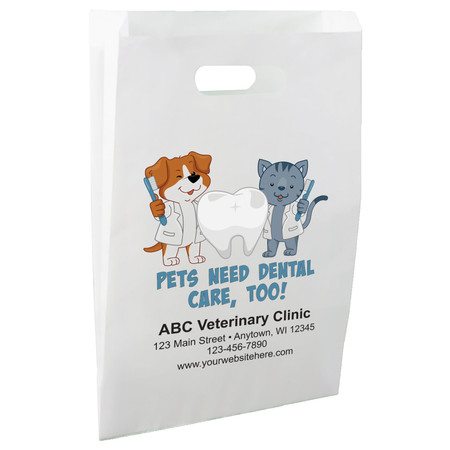 White die-cut handle paper bag featuring illustrated dog and cat dental characters holding toothbrushes beside a tooth graphic and the message "PETS NEED DENTAL CARE, TOO!"

