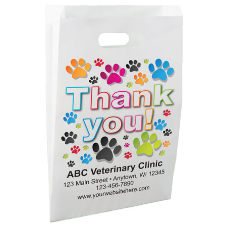White die-cut handle paper bag featuring colorful paw prints surrounding the message "Thank you!" in large multicolored lettering.

