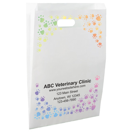White die-cut handle paper bag featuring a rainbow-colored border of paw prints surrounding an open center area.

