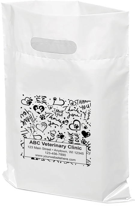 White plastic veterinary tote bag with a die-cut handle featuring a black pattern of paw prints, hearts, and repeated "Thank You" text surrounding a personalized clinic information panel displaying ABC Veterinary Clinic, address, phone number, and website.