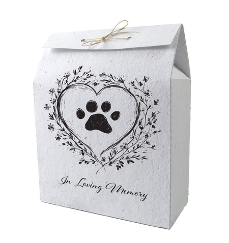 Plantable memorial bag featuring a black paw print inside a heart with floral accents and the phrase “In Loving Memory” beneath.