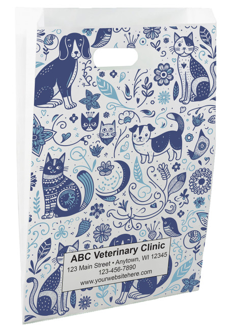 White die-cut handle paper bag featuring a blue illustrated pattern of dogs, cats, birds, flowers, hearts, and botanical elements.