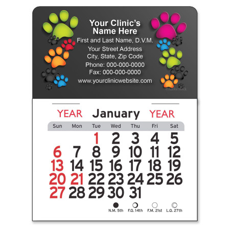 Mini calendar with colorful paw prints in green, pink, orange, blue, and black surrounding a customizable veterinary clinic imprint area on a dark background.

