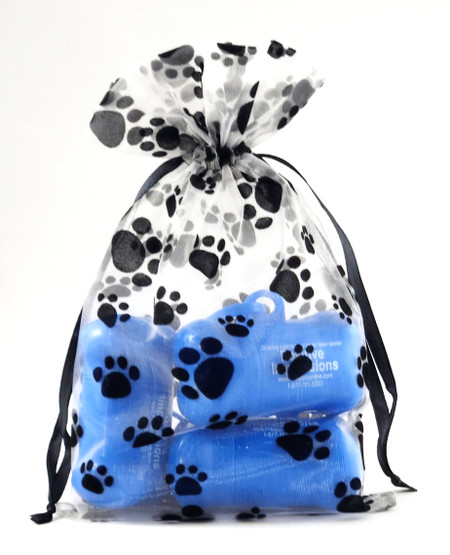 Sheer organza drawstring bag with black flocked paw prints and black satin ribbon closure. Translucent material displays an all-over paw print pattern on the front and back.

