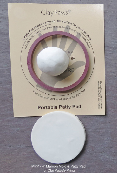 Maroon 4 inch circle mold and patty pad for creating ClayPaws® paw print impressions using one clay kit.