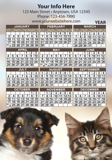 Close-up puppy and tabby kitten portraits beneath a year calendar with brown month headers and personalized business information area.