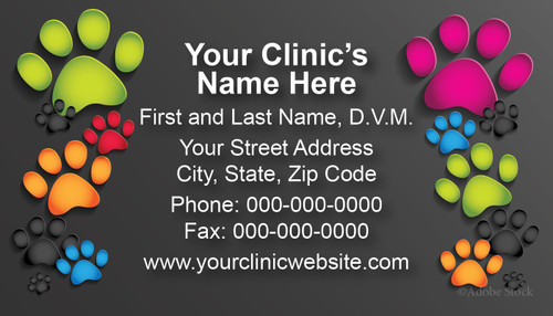 Veterinary business card featuring multicolored paw prints on a charcoal gray background framing centered clinic contact information.

