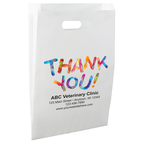 White die-cut handle paper bag featuring the message “THANK YOU!” in large multicolored geometric lettering above a clinic information area.

