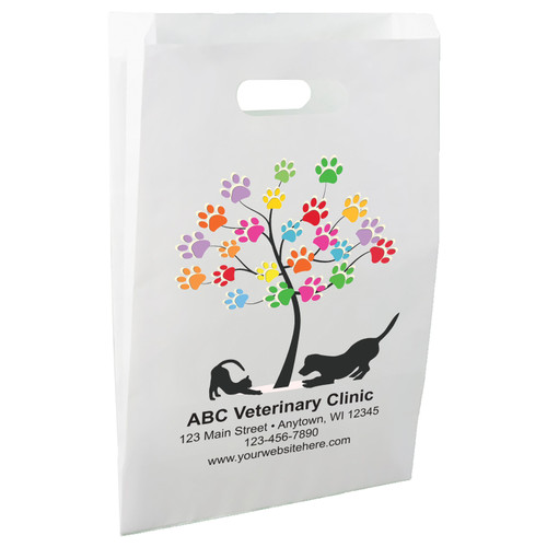White die-cut handle paper bag featuring a colorful paw print tree with dog and cat silhouettes.

