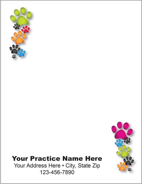 Quarter-size veterinary notepad with colorful green, pink, orange, blue, and black paw print borders in opposite corners and clinic information area.

