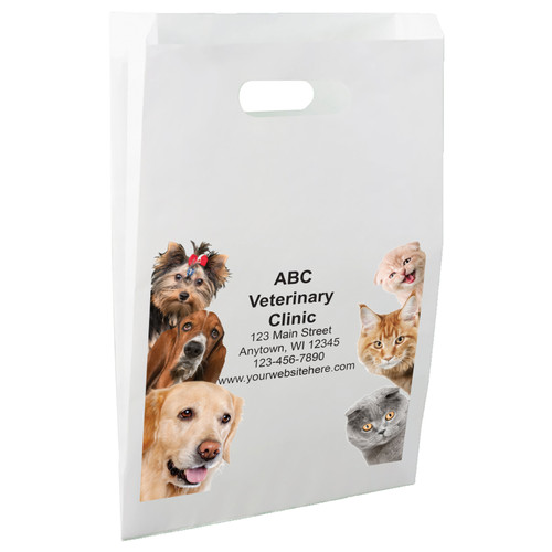 White die-cut handle paper bag featuring dog and cat photographic portraits peeking in from both sides around a centered clinic information area.

