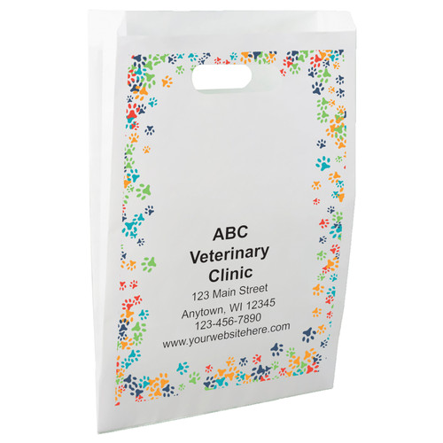 White die-cut handle paper bag featuring a colorful border of blue, green, orange, red, and navy paw prints.

