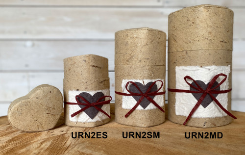 Pet Peaceful Return Kraft Heart Extra Small pet urn with natural fiber finish, white memorial panel, dark brown heart accent, and red ribbon bow