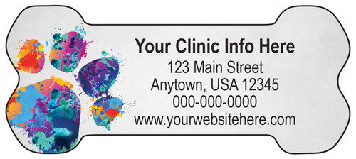 Bone-shaped veterinary die-cut magnet featuring a colorful paint splatter paw print on the left side with personalized clinic information on a gray background.

