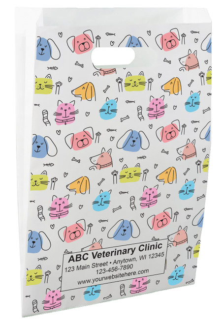 White die-cut handle paper bag featuring colorful cat and dog faces, hearts, paw prints, bones, and fishbone graphics in a repeating pattern.

