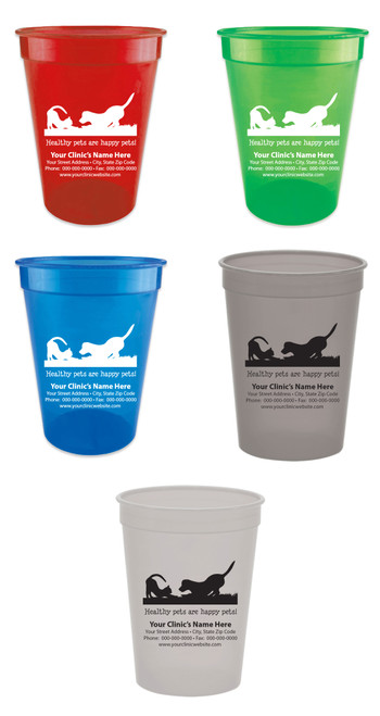 Personalized pet food measuring cup featuring a dog and cat playing silhouette above the phrase "Healthy pets are happy pets!" with customizable clinic name, address, phone number, fax number, and website information. Displayed in multiple cup colors with black or white imprint options.

