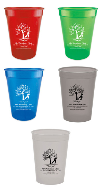 Personalized pet food measuring cup featuring a leafy tree and sitting dog illustration above a "Thank you!" message with custom veterinary clinic name, address, phone number, and website information.

