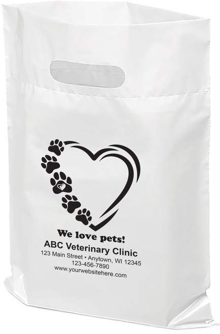 Veterinary tote bag with heart shape and paw print design, “We love pets!” text, and space for personalized clinic details.