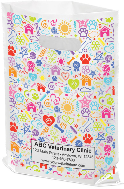 White tote bag with colorful stars, pawprints, and animal houses in a repeating pattern.