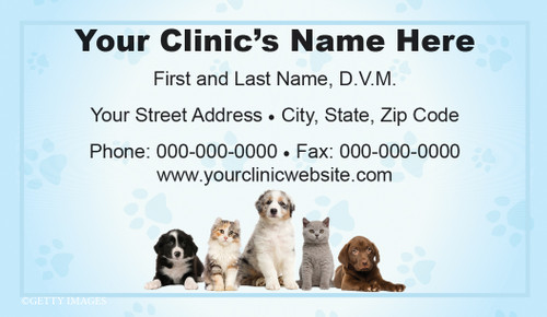 Veterinary business card featuring puppies and kittens beneath centered contact information with light blue paw print accents and a matching border.

