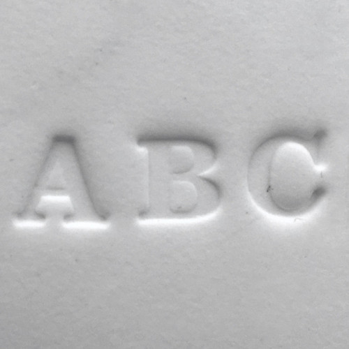 Alphabet letter stamp set handle creating letter impressions in clay, displaying embossed letters A, B, and C from a memorial personalization accessory used with paw print impression kits.

