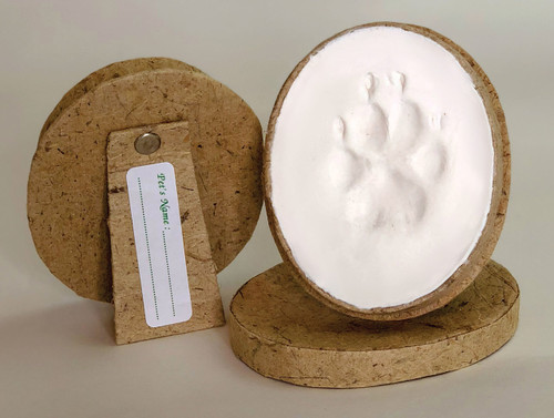 Pet Oval Keepsake Impression Kit with natural fiber oval frame, air-dry paw print impression, pet name label, and easel-back display stand.