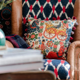 FASNACHT  Cushion (LC40193) by Mind The Gap | LC40193 | TYROL APRES-SKI HOME COLLECTION | 20 x 20 in | Blue, Green, Red, Taupe | Fabric Carolina | https://www.fabriccarolina.com/