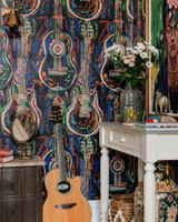 HARMONY Dark Wallpaper (WP20614) by Mind The Gap | WP20614 | WOODSTOCK '69 | 3 rolls x 52x300 cm / 20.5x118.1 in | 0.52m / 20.5in | 3m / 118in | 4.65sqm / 50sq ft | 100cm / 39.3in | Black, Blue, White, Green, Orange, Brown, Purple | Non-woven Satin | Paste the wall | 3-rolls in a box | Fabric Carolina | https://www.fabriccarolina.com/