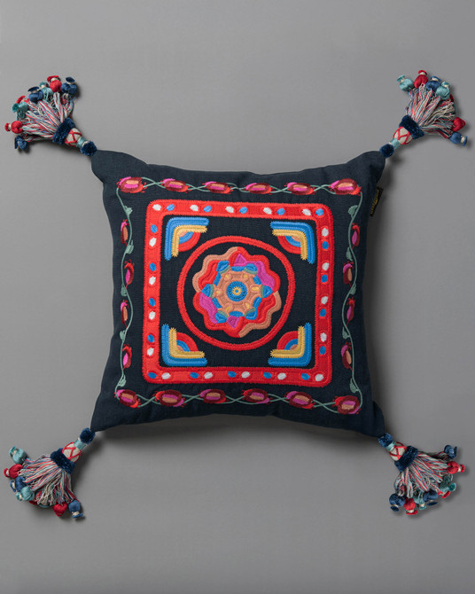 CARNIVAL embroidered cushion (LC40266) by Mind The Gap | LC40266 | TRANSYLVANIAN RHAPSODY | 50 x 50 cm / 20 x 20 in | Blue, Yellow, Pink, Red | Tasseled corners | Duck feather | 100% Linen | Fabric Carolina | https://www.fabriccarolina.com/