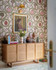 TWO STORKS Taupe Wallpaper (WP20900) by Mind The Gap | WP20900 | TRANSYLVANIAN RHAPSODY | 1 roll x 52 x 900 cm / 20.47 x 354.33 in | 0.52m / 20.5in | 9m / 354in | 4.68sqm / 50sq ft | 100cm / 39.3in | Taupe, Green, Red | Non-woven Textured | Paste the wall | 1 roll in a box | Fabric Carolina | https://www.fabriccarolina.com/