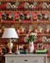 CARNAVAL Wallpaper (WP20610) by Mind The Gap | WP20610 | WOODSTOCK '69 | 3 rolls x 52x300 cm / 20.5x118.1 in | 0.52m / 20.5in | 3m / 118in | 4.65sqm / 50sq ft | 100cm / 39.3in | Green, Yellow, Red, Burgundy | Non-woven Satin | Paste the wall | 3-rolls in a box | Fabric Carolina | https://www.fabriccarolina.com/