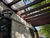 AJH10 angled joist hanger installed on ledger supporting sloped rafter beam, clean exposed timber look with full flange mounting, custom fabricated by Cutting Edge Metals