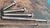 "1/2 inch hex head lag screws in zinc plated and unfinished plain steel displayed on shelf – 1.5 to 4 inch heavy-duty lengths from Cutting Edge Metals"