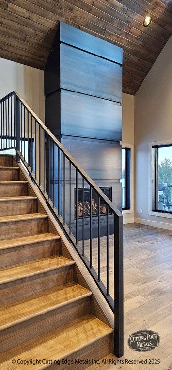 The "Matack" Surround. These custom fireplace surrounds were made for a great client of ours that has a beautiful cabin in the north woods of MN. The custom sizes and shapes of these two surrounds fit their space perfectly, complimenting the materials they used to build their retreat. Made of steel, these surrounds will last forever and the esthetics of them will be admired for generations to come.