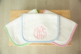 pink, green and blue burp cloths