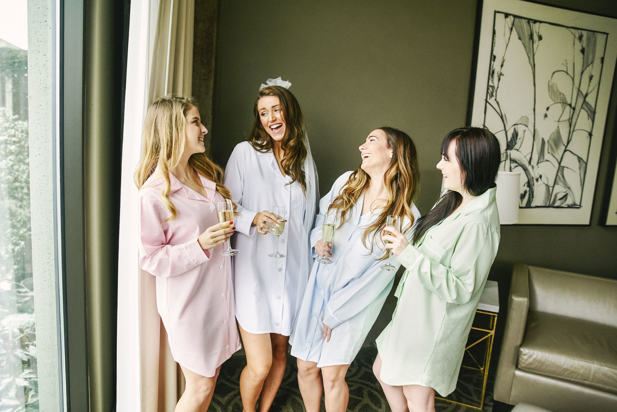 bridal party wearing the pink, white, blue and green seersucker lounge shirts