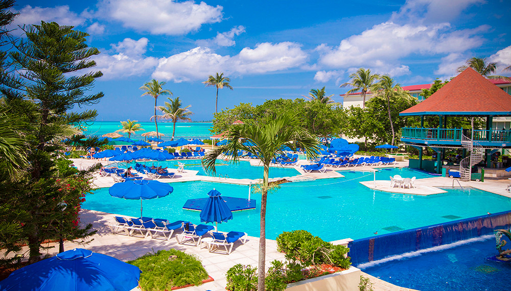 Large pool area and loungers at Breezes Resort in Nassau. 