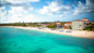 View of the large private white sand beach at Breezes Resort in Nassau.
