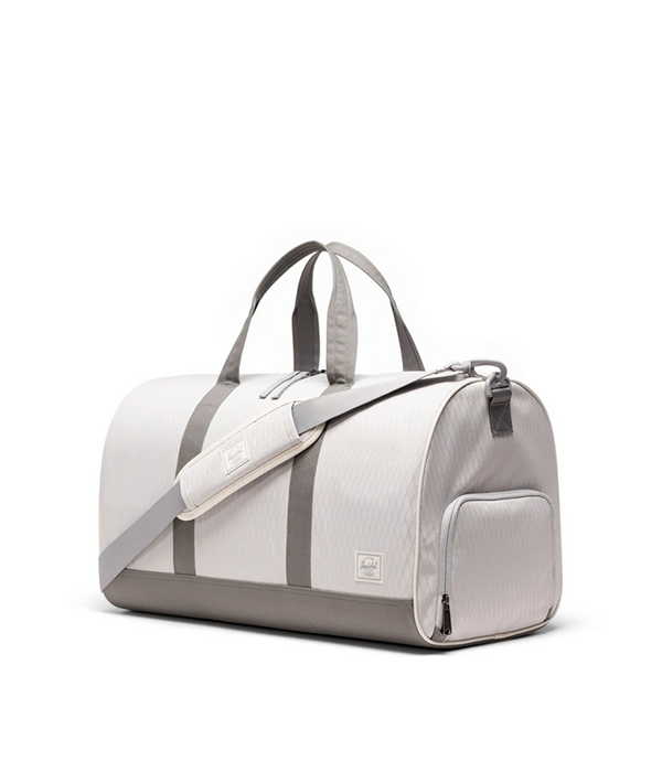 Shop Herschel Novel Duffle in Vapor Diamond/Charcoal Gray S26